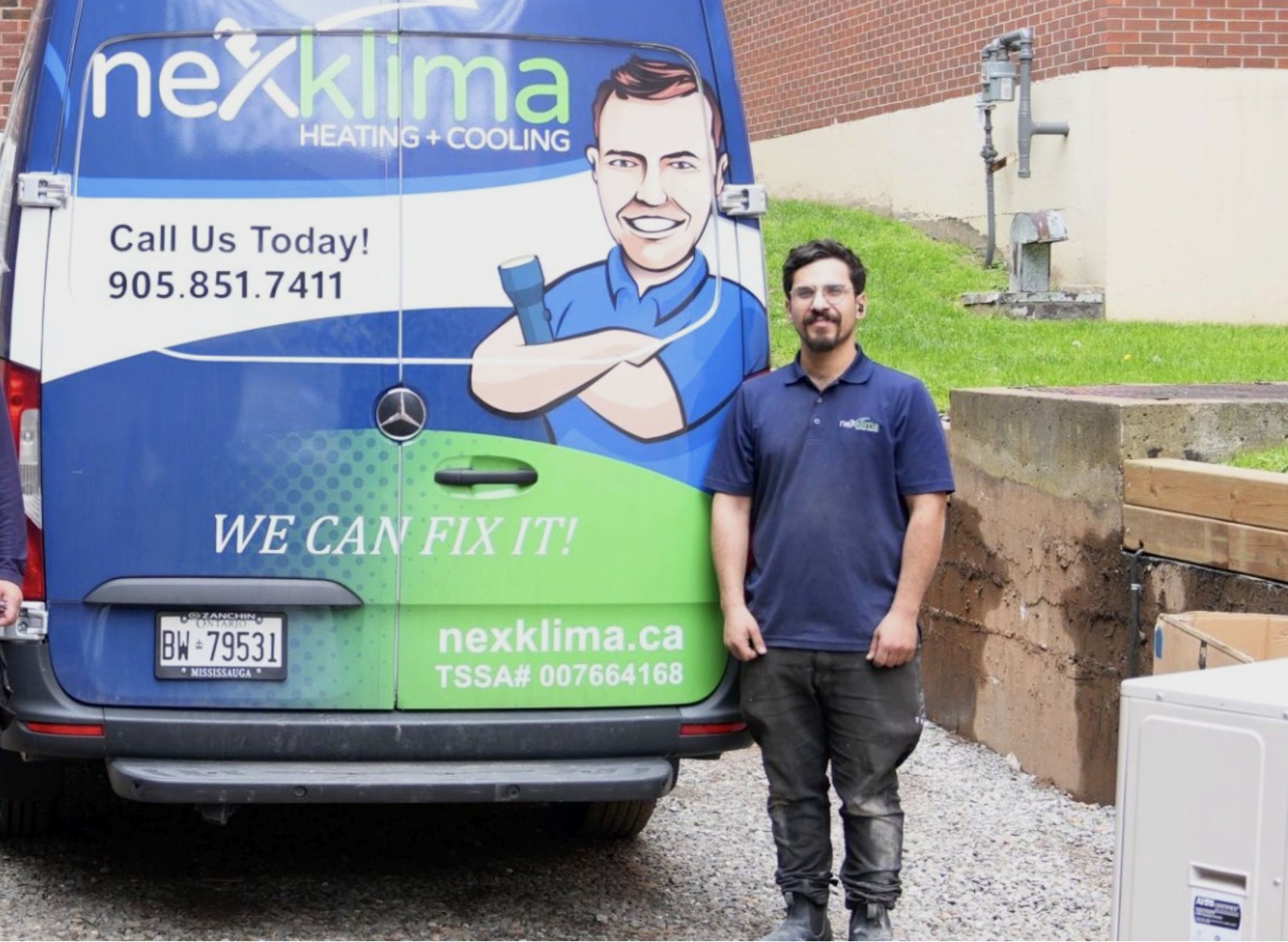 Nexklima technician beside a branded Nexklima service van